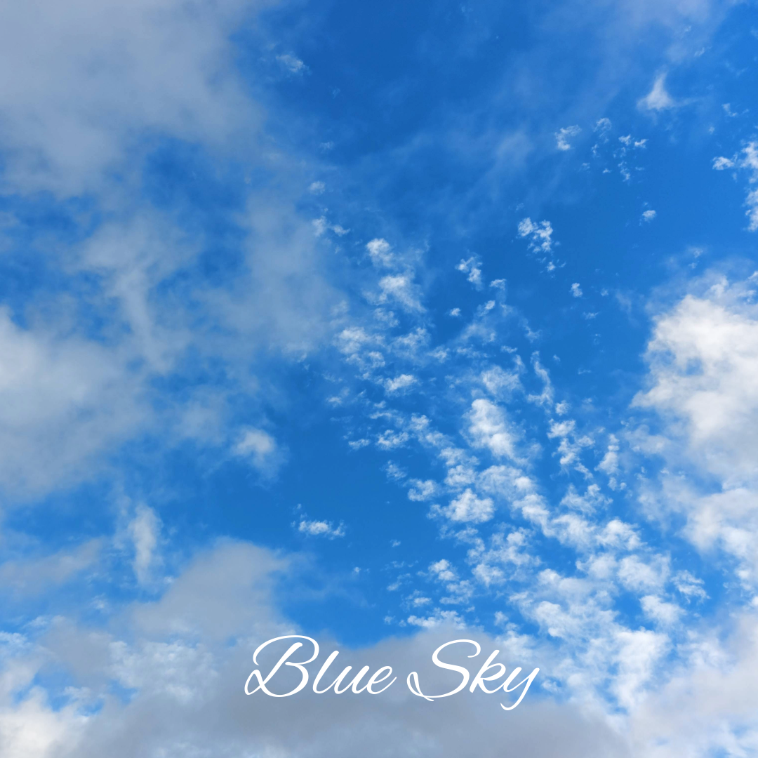 A selection of Lamsopal Jewellery's Blue Sky Collection, featuring silver rings and pendants set with vibrant blue Australian opals against a soft sky-blue background.