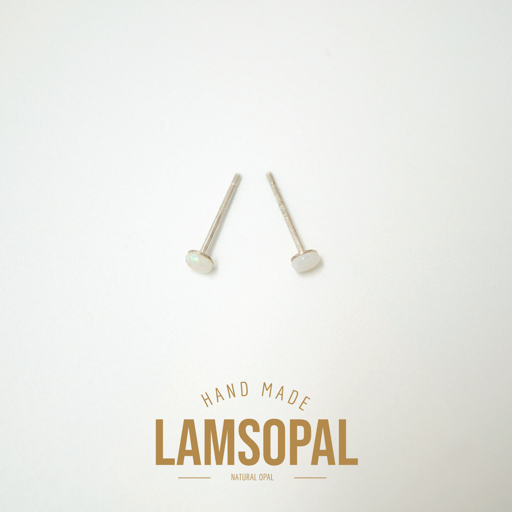 A pair of small natural opal stud earrings with silver posts, displayed on a clean white background with a gold 'LAMSOPAL HAND MADE' logo at the bottom.
