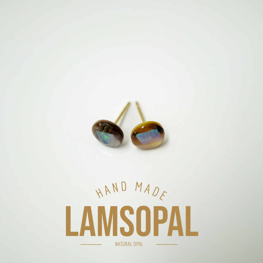 A pair of handmade Lamsopal natural opal stud earrings with gold posts, displayed on a clean white background with gold text below reading 'HAND MADE LAMSOPAL NATURAL OPAL'.