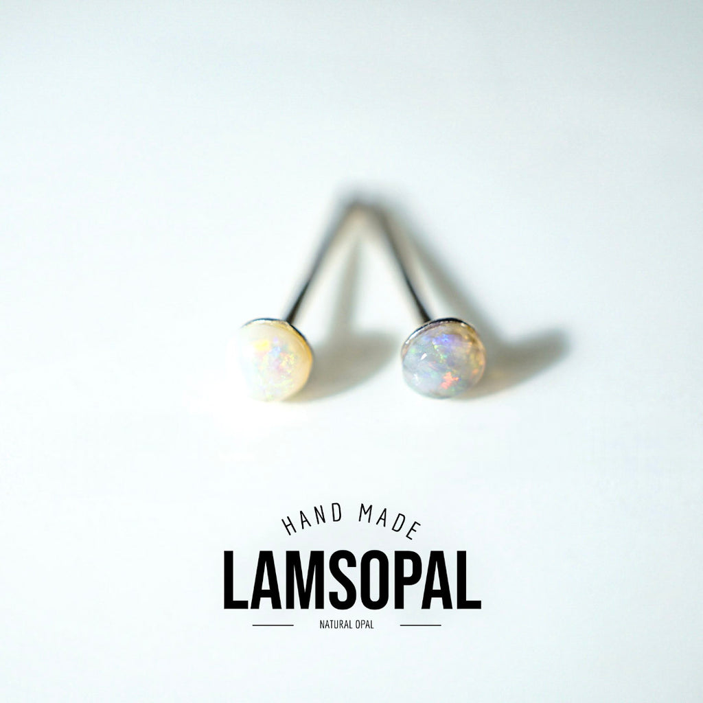 Two natural opal stud earrings with black posts, displayed on a clean white background with a logo overlay that reads 'HAND MADE LAMSOPAL NATURAL OPAL'.