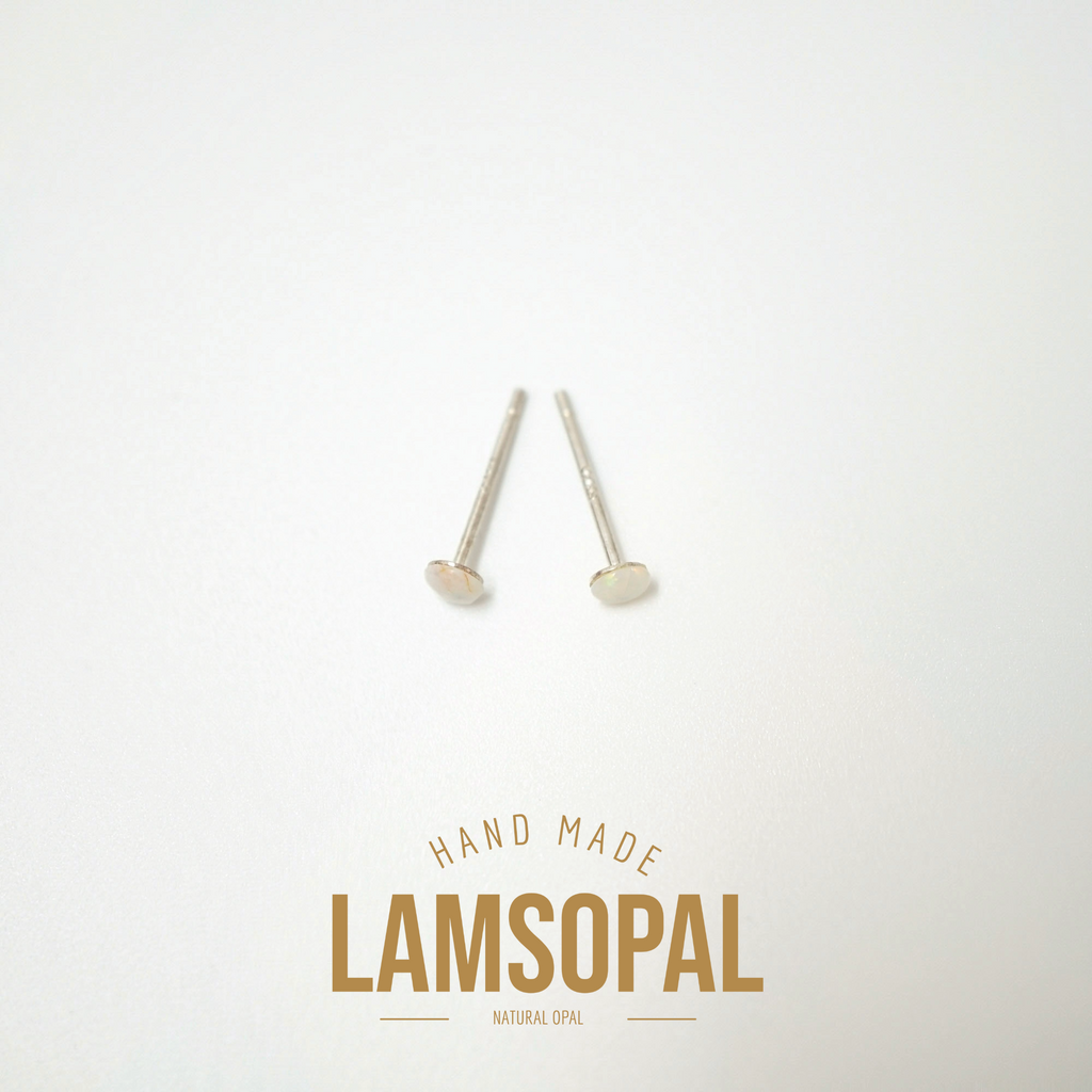 Two small silver-toned natural opal stud earrings on a clean white background, with the brand name 'LAMSOPAL' and 'HAND MADE' printed below.
