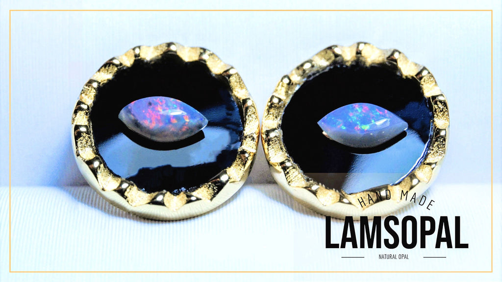Gold-framed earrings with opal stones on a white background, featuring the brand 'LAMSOPAL'.