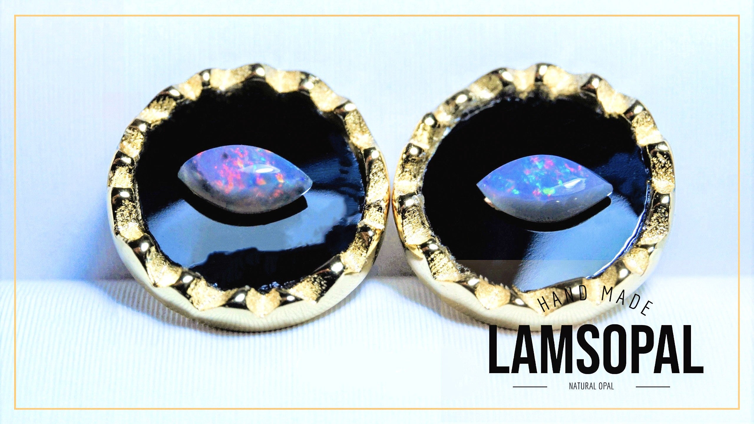 Gold-framed earrings with opal stones on a white background, featuring the brand 'LAMSOPAL'.