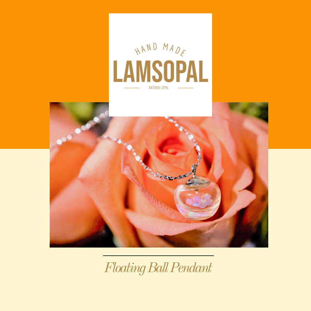 LAMSOPAL floating ball pendant on an orange and beige background with a rose.