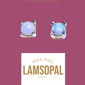 A pair of Lamsopal natural opal stud earrings in a four-prong setting, shown against a dusty rose background with a white label below reading 'HAND MADE LAMSOPAL NATURAL OPAL'.
