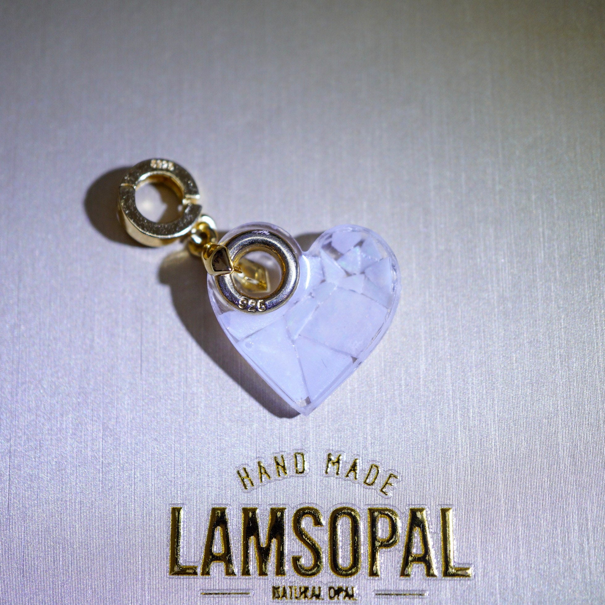 Heart-shaped Pendant with gold accents on a light gray background, featuring 'LAMSOPAL' branding.