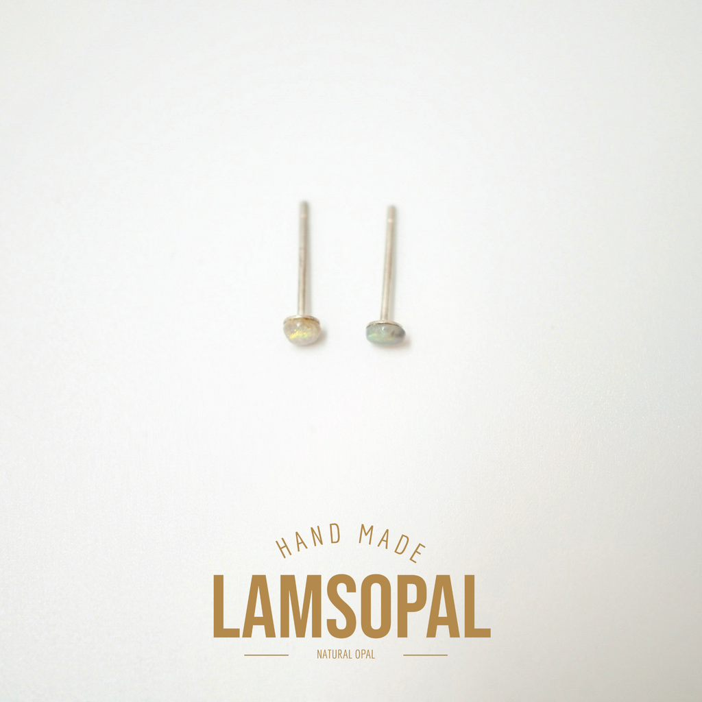 A pair of natural opal stud earrings with gold-toned posts, displayed on a clean white background with a gold 'LAMSOPAL HAND MADE' logo at the bottom.