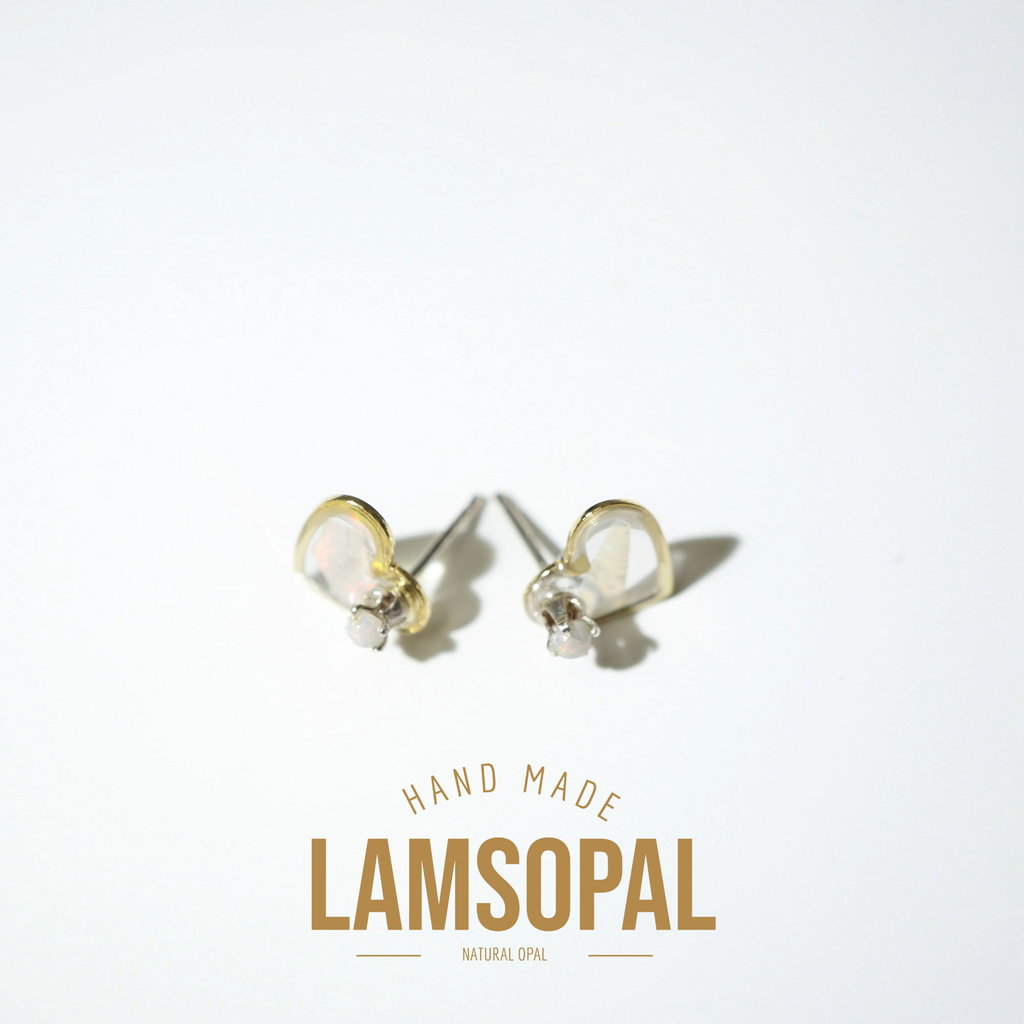 A pair of handmade Lamsopal natural opal stud earrings with gold and silver settings, displayed on a clean white background with a gold 'HAND MADE LAMSOPAL NATURAL OPAL' text overlay at the bottom.