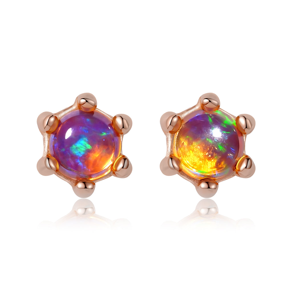Multicolored opal stud earrings with rose gold setting on a white background