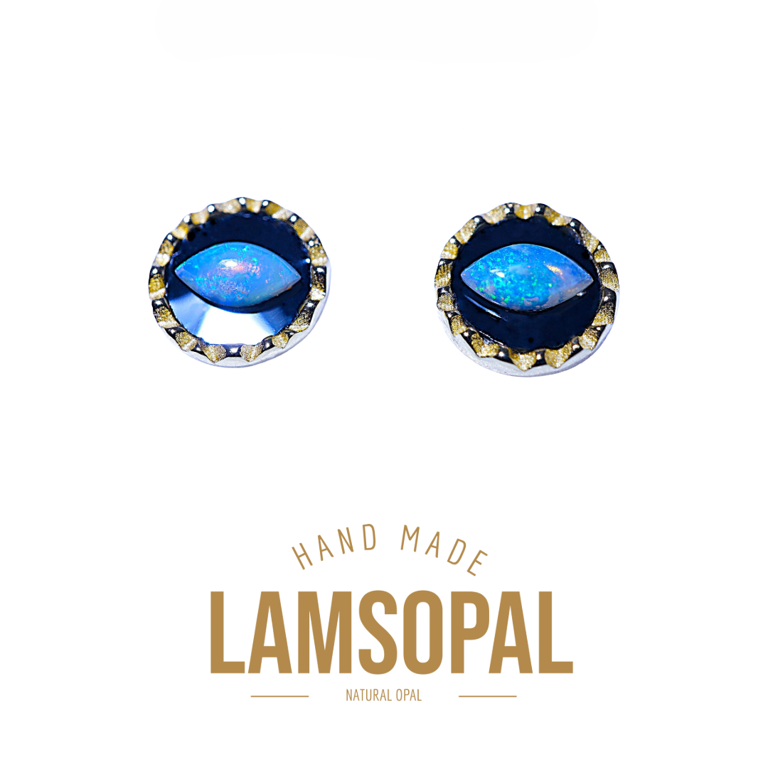 A pair of Lamsopal natural opal stud earrings with a deep blue marquise-cut opal center and a gold-toned scalloped bezel setting, shown on a white background with 'HAND MADE LAMSOPAL NATURAL OPAL' text below.
