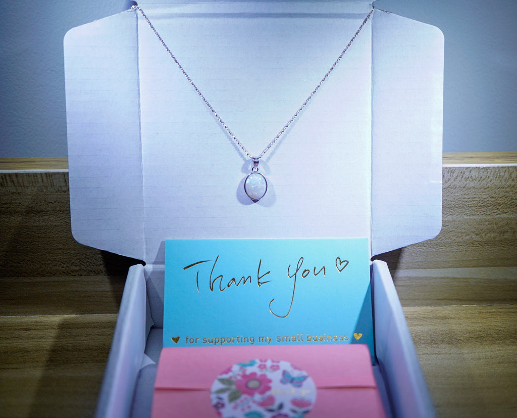 LamsOpal Necklace with a 'Thank you' card in a packaging