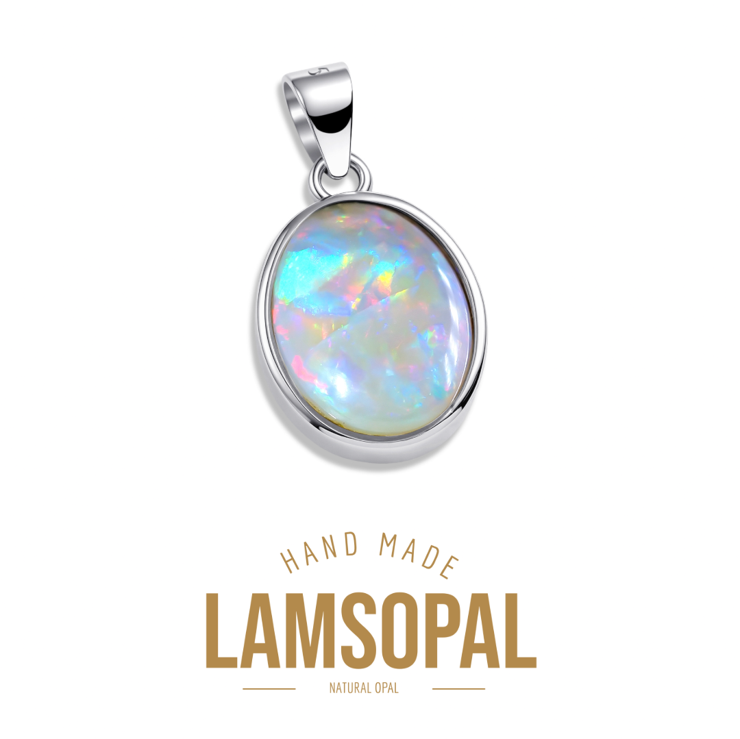 A silver pendant with a round, iridescent opal gemstone, shown against a white background with the text 'HAND MADE LAMSOPAL NATURAL OPAL' below it.