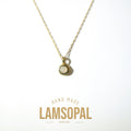 A gold chain necklace with a small oval pendant featuring a natural opal in a bezel setting, displayed on a clean white background with 'HAND MADE LAMSOPAL NATURAL OPAL' text below.