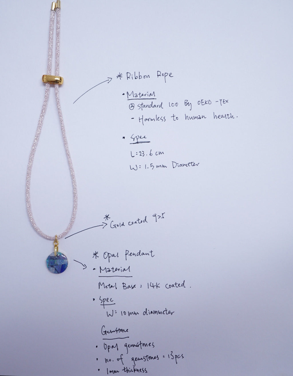 A handmade beaded necklace with a blue and white patterned pendant, displayed on a white sheet of paper with handwritten specifications and labels.