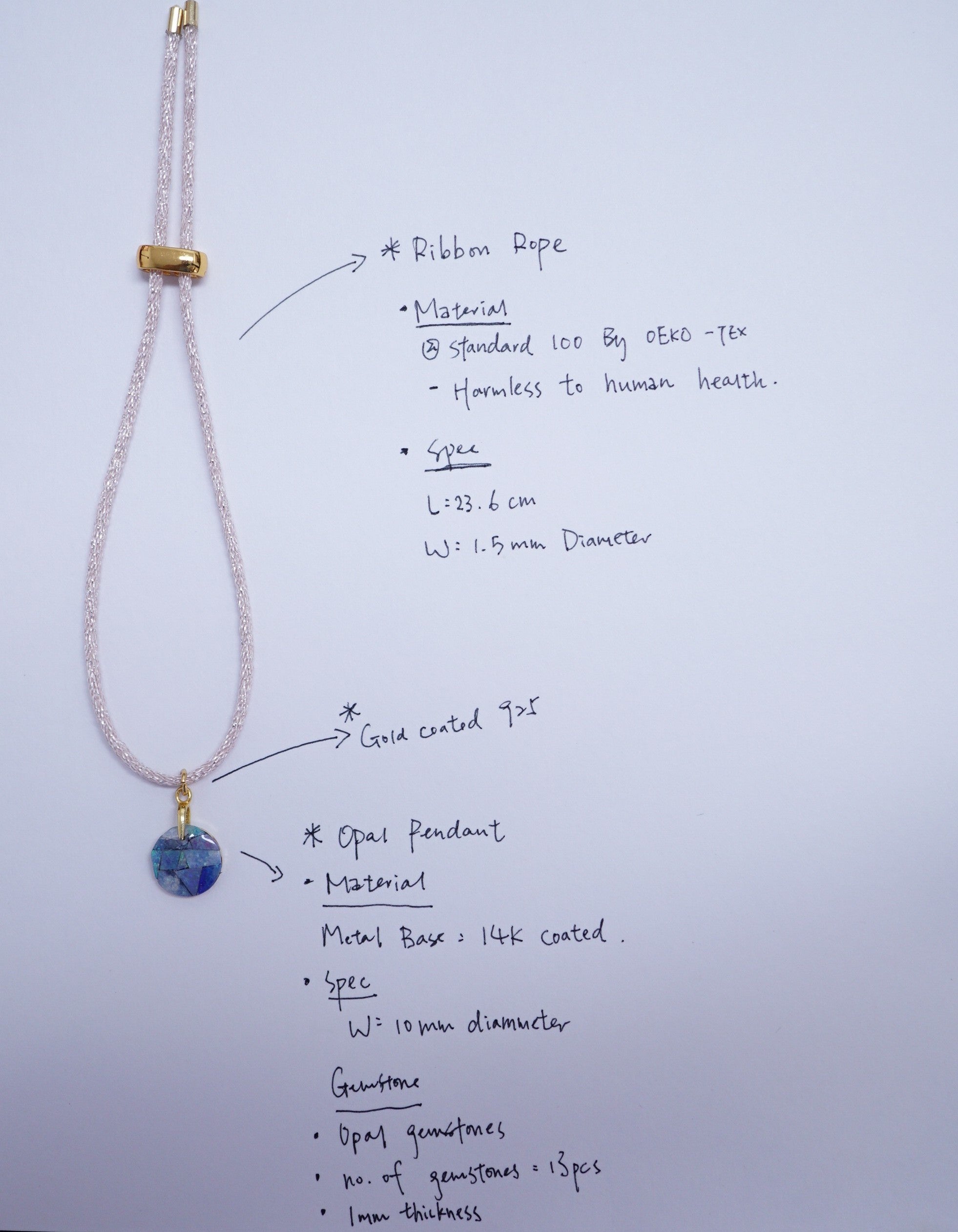 A handmade beaded necklace with a blue and white patterned pendant, displayed on a white sheet of paper with handwritten specifications and labels.