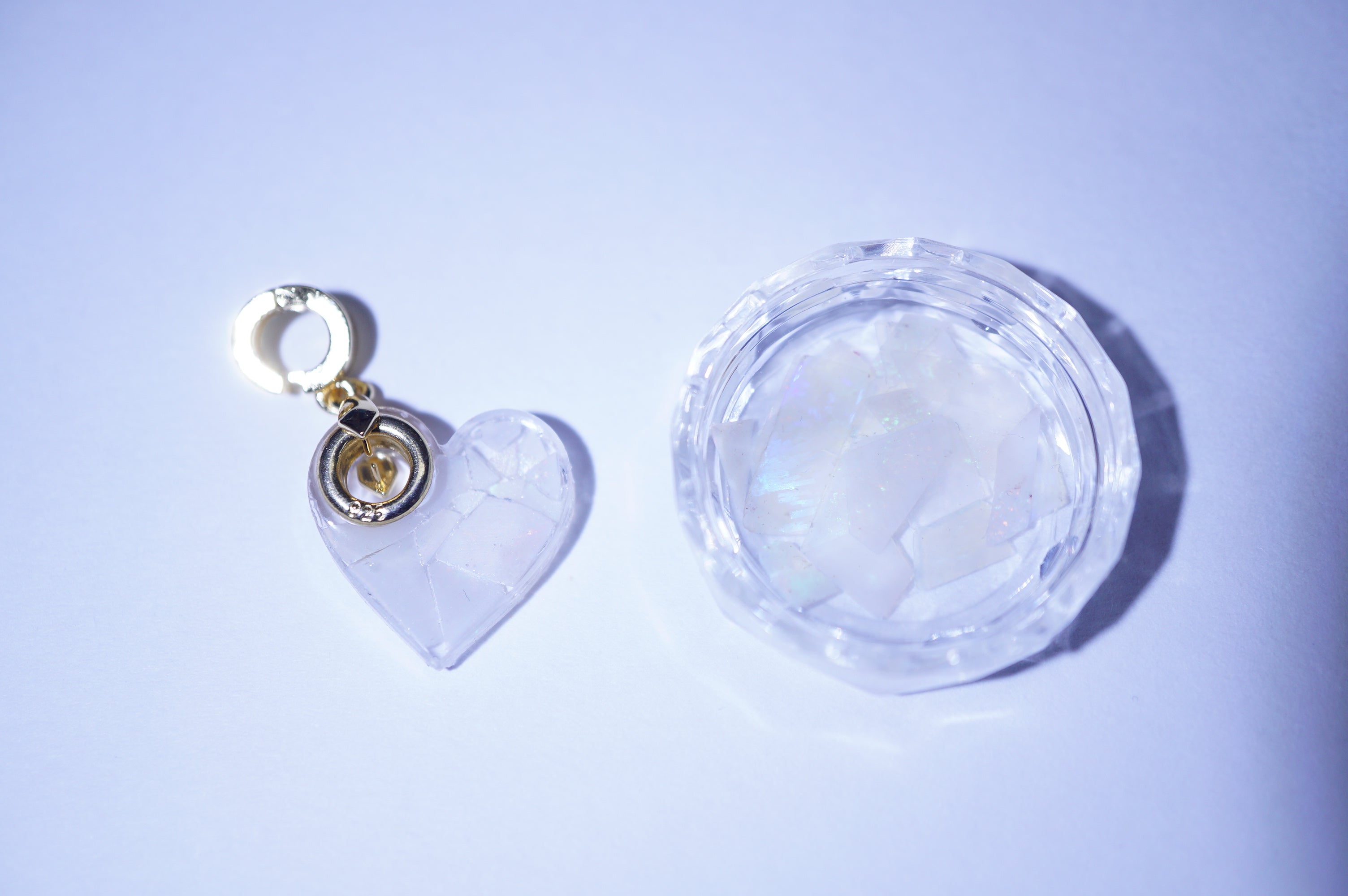 Heart-shaped keychain with gold pendant 