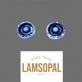 Two round handmade opal jewelry pieces with blue and silver inclusions, displayed above a white label that reads 'HAND MADE LAMSOPAL NATURAL OPAL' on a solid gray background.