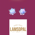 A pair of handmade stud earrings featuring round iridescent white opal gemstones in a silver-toned claw setting, displayed above a white card with the brand name 'LAMSOPAL' on a solid dark magenta background.