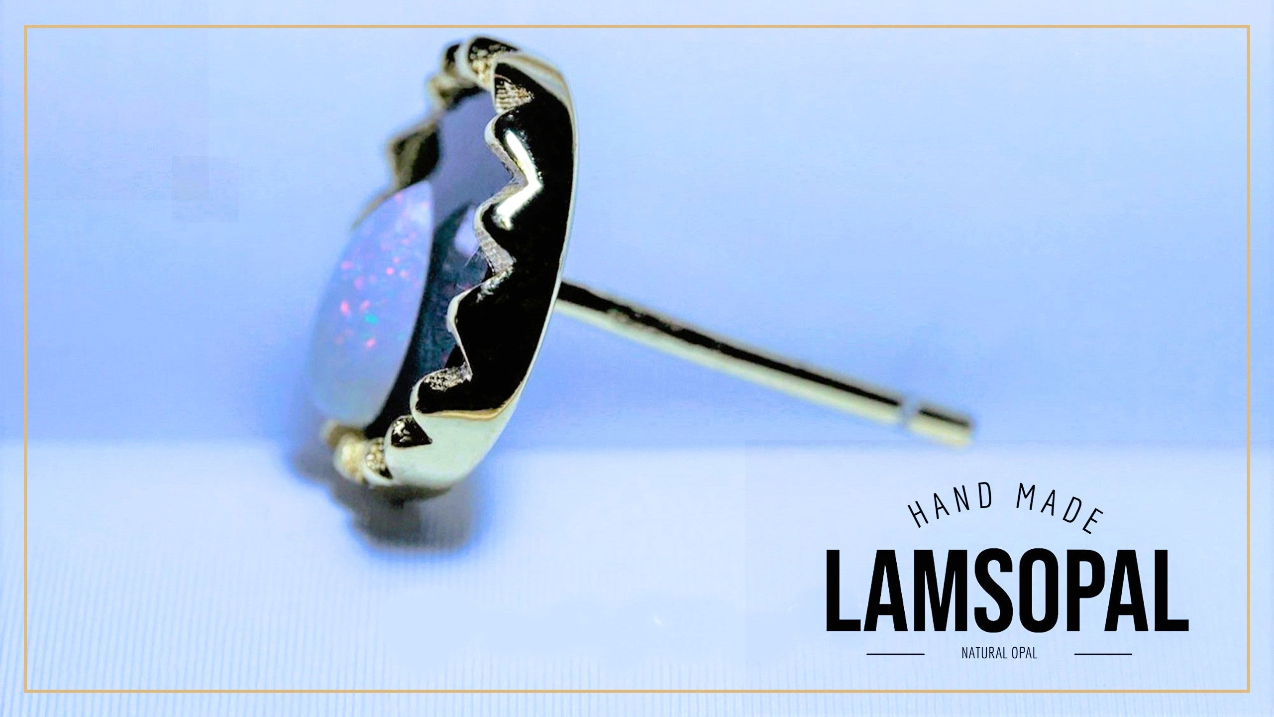 A single gold-toned stud earring with a round iridescent opal inlay, shown on a light blue background with the text 'HAND MADE LAMSOPAL' in the lower right.