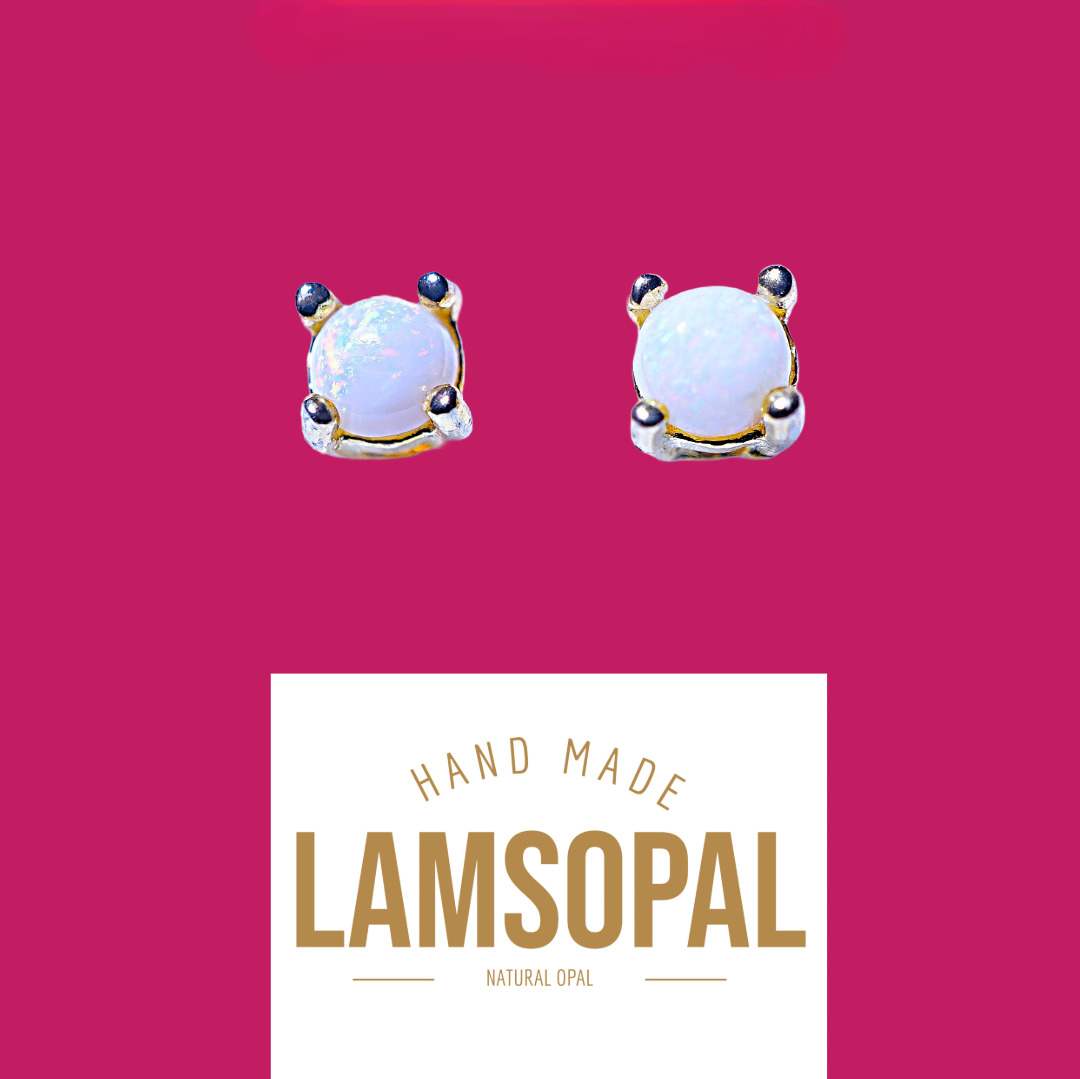 A pair of Lamsopal handmade natural opal stud earrings with gold and silver settings, displayed on a vibrant magenta background with a white brand label below.