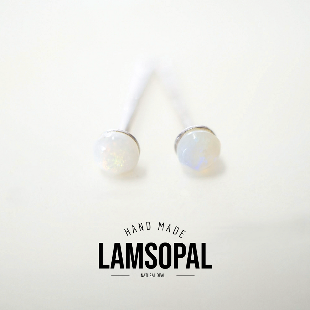 Two natural opal stud earrings with white opal cabochons and silver-toned settings, shown on a clean white background with a 'HAND MADE LAMSOPAL NATURAL OPAL' text overlay at the bottom.