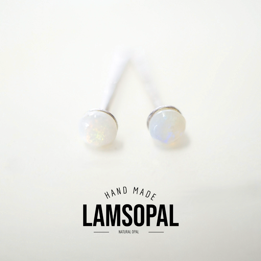 Two natural opal stud earrings with white opal cabochons and silver-toned settings, shown on a clean white background with a 'HAND MADE LAMSOPAL NATURAL OPAL' text overlay at the bottom.