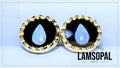 A pair of handmade Lamsopal natural opal teardrop stud earrings with gold bezel settings and black inlay, displayed on a light blue background with a gold border.