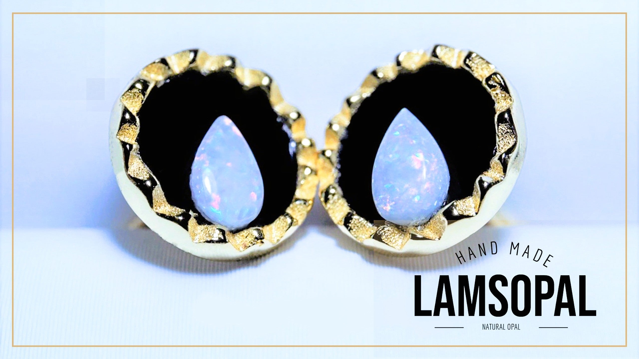 A pair of Lamsopal hand-made natural opal stud earrings with gold bezel settings and a black inlay, displayed on a light blue background with a white border and text overlay.
