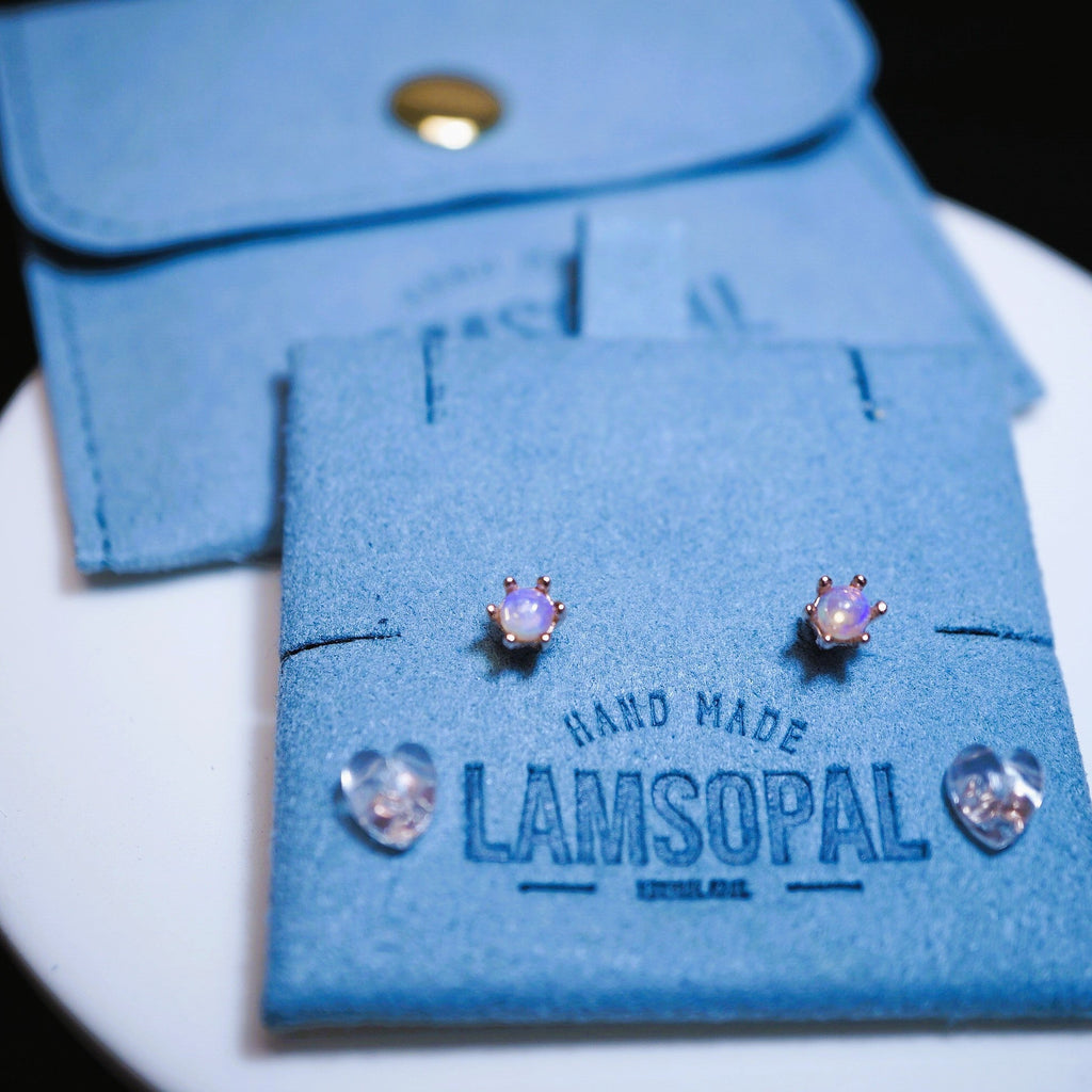 LAMSOPAL earrings on a branded blue packaging